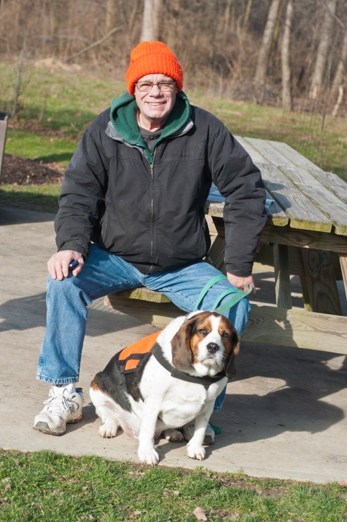 Paul, a retiree, and his dog Murphy are trail monitors for the park district. They put in a lot of volunteer hours walking the parks and helping visitors.